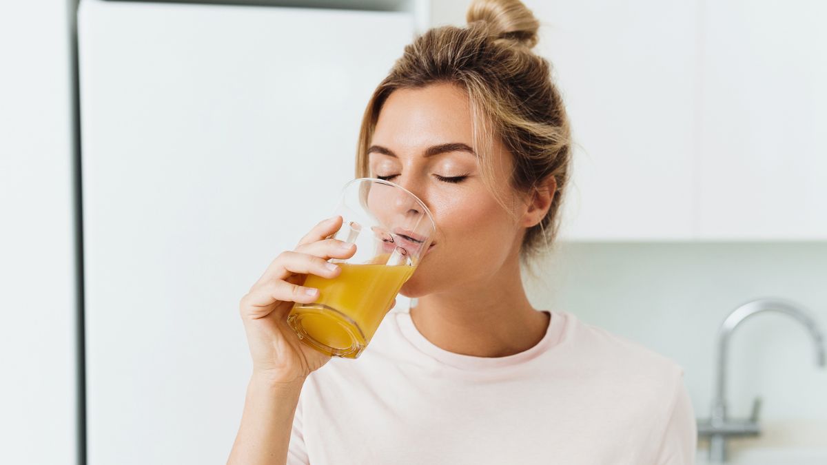 woman drinking a health juice