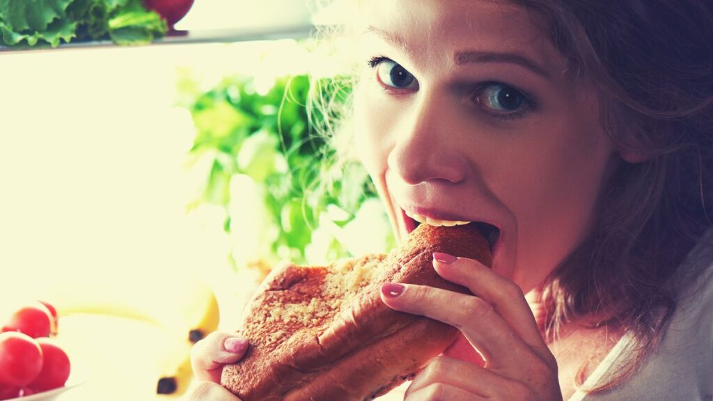 woman eating sandwich