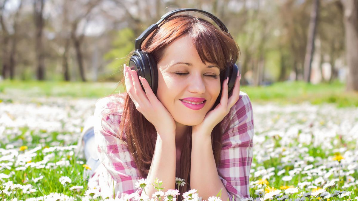 woman listening to music on headphones