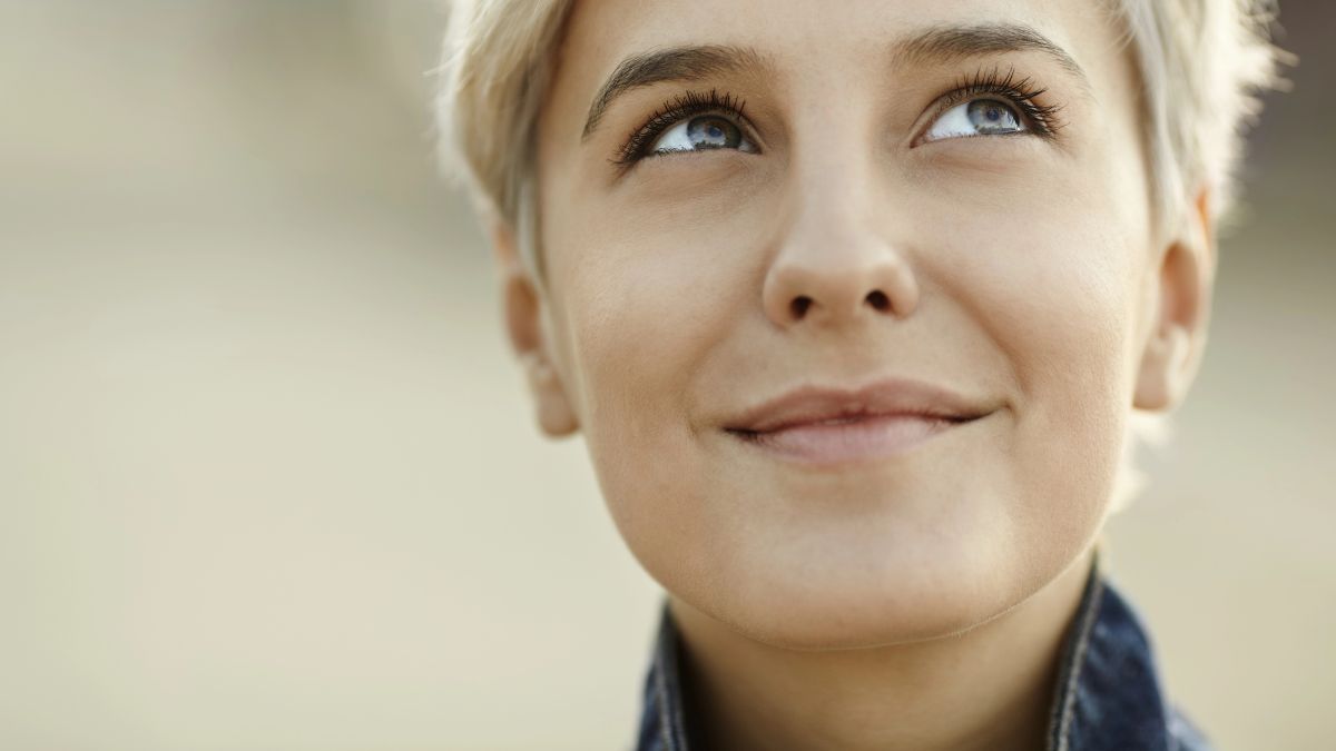 woman looking up smiling