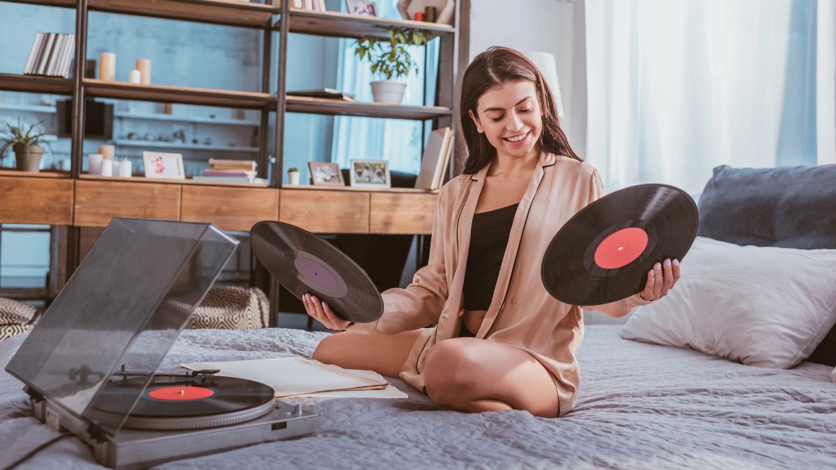 woman sitting with records