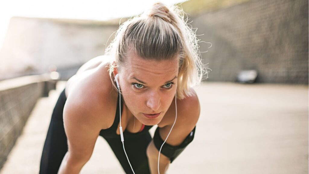 woman taking a breath after running