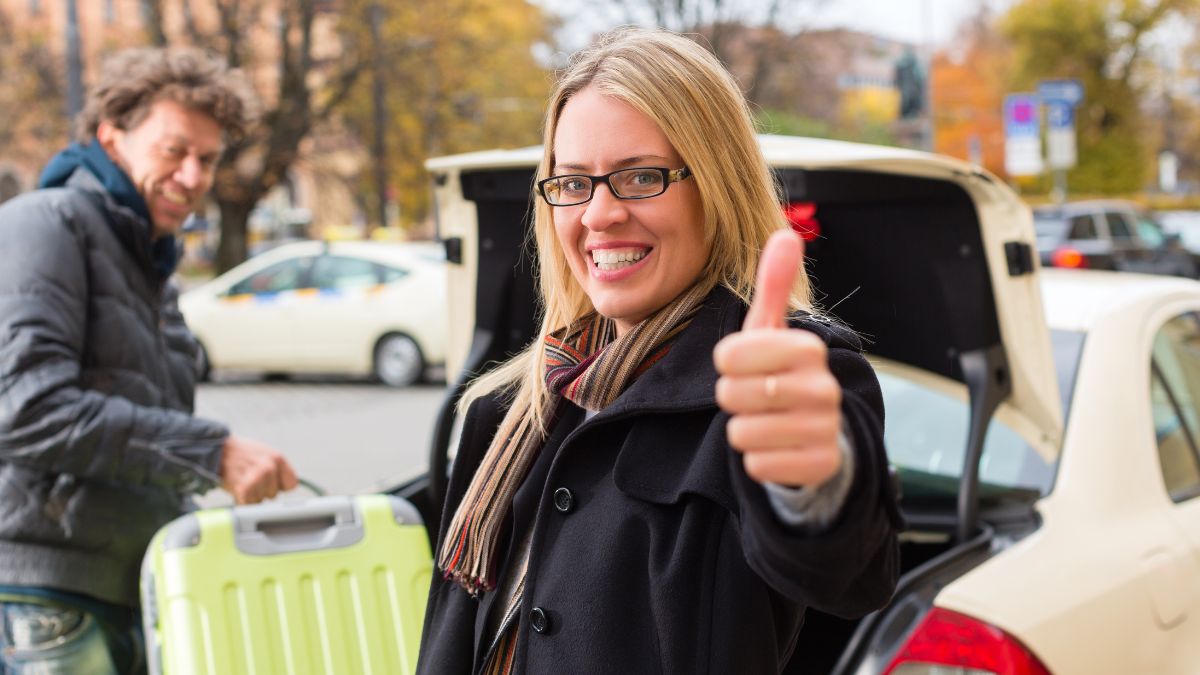 woman traveling and giving thumbs up