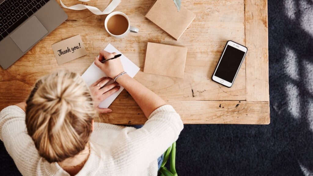 woman writing a card