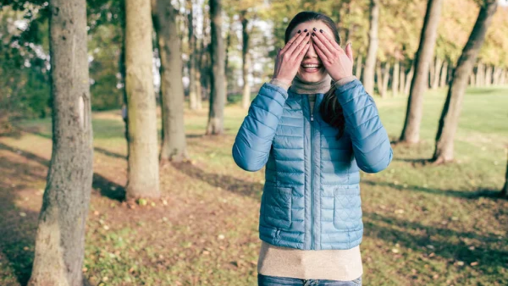 Woman Woods Hands Over Eyes