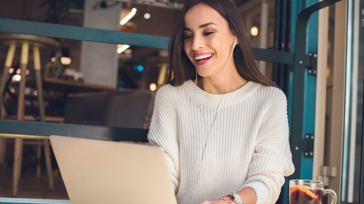 happy woman on computer doing remote work