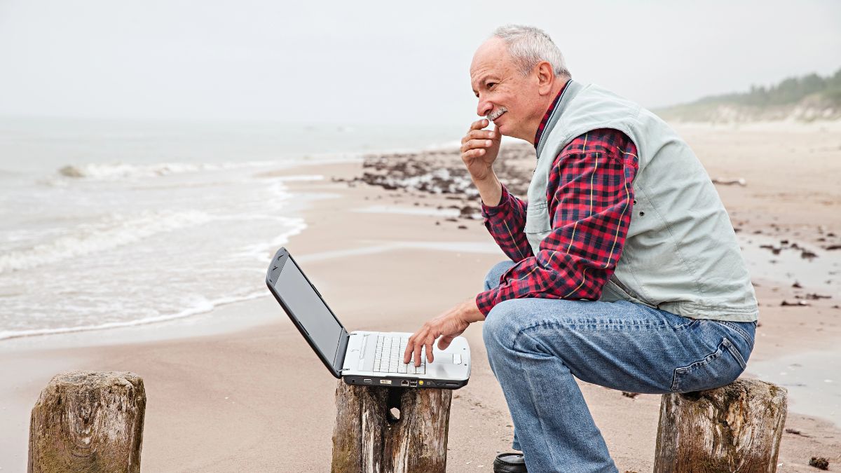 older man working on the beach