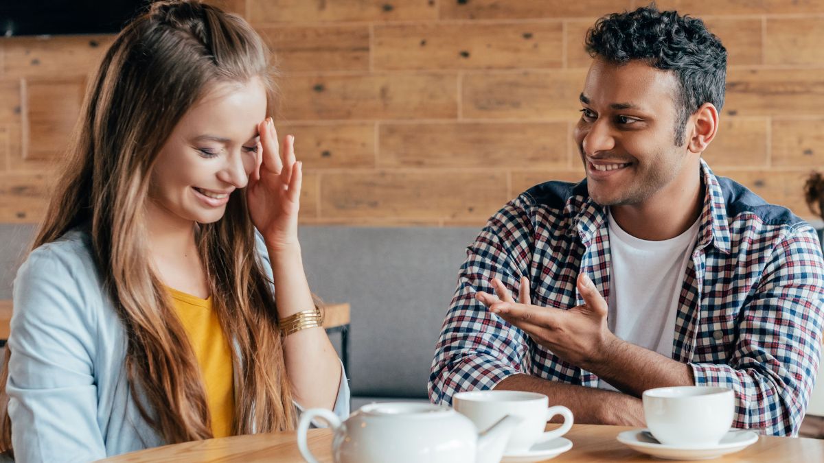 shy woman sitting on a date with a man