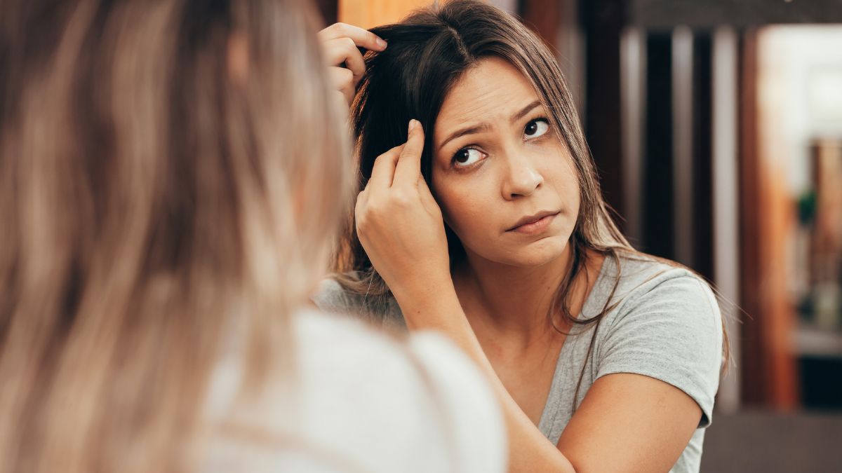 woman looking in the mirror for greys