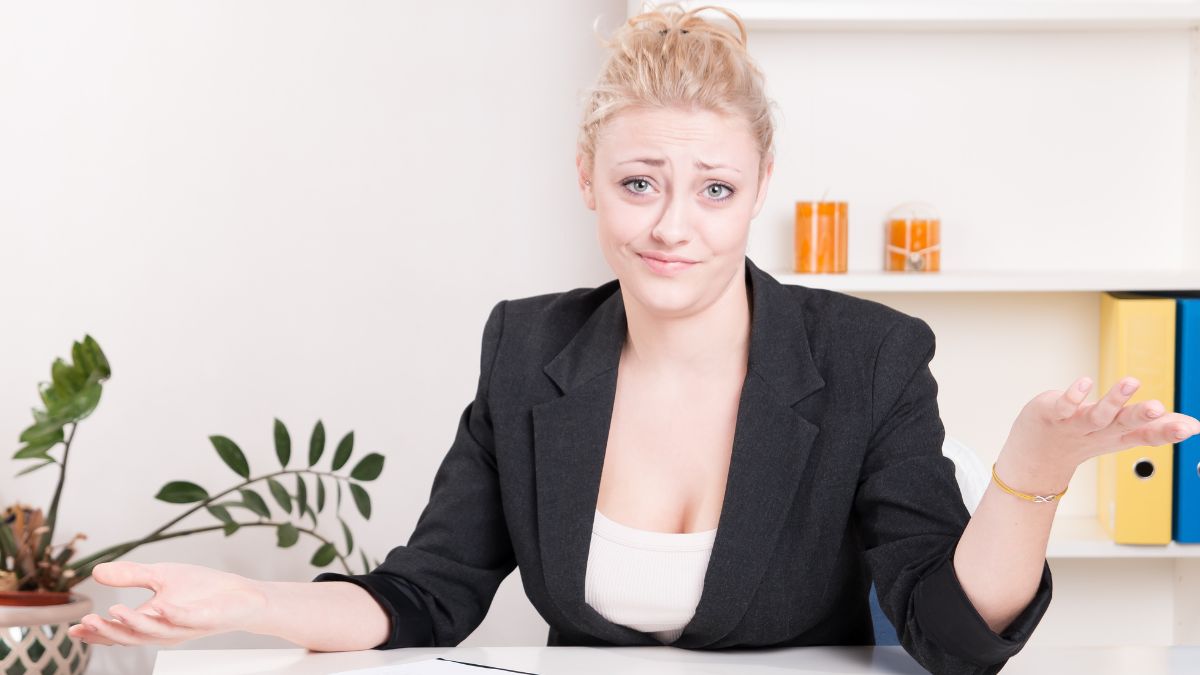 woman looking irritated with hands up