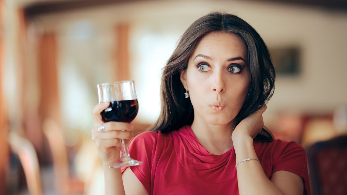 woman looking shocked at a bar