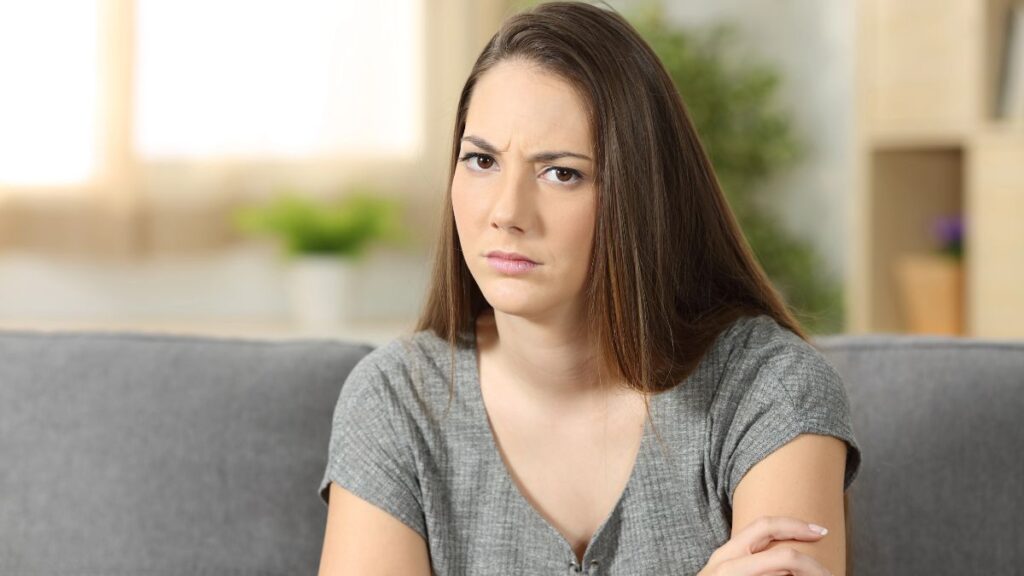 woman looking upset with arms crossed