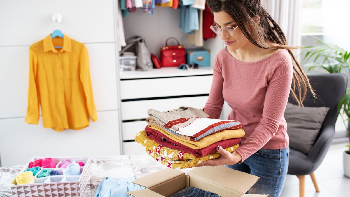 woman packing clothes for donation