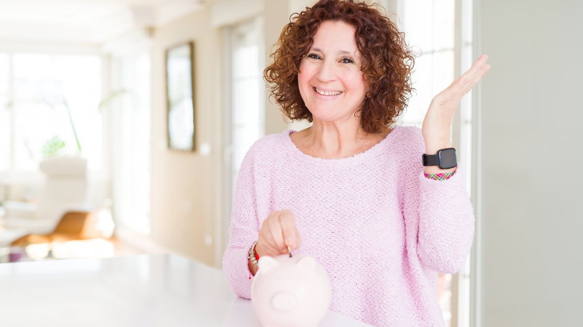 woman saving money in piggy bank