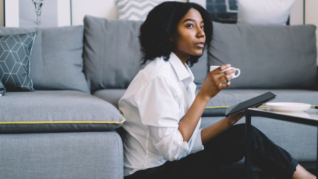 woman sitting at home thinking