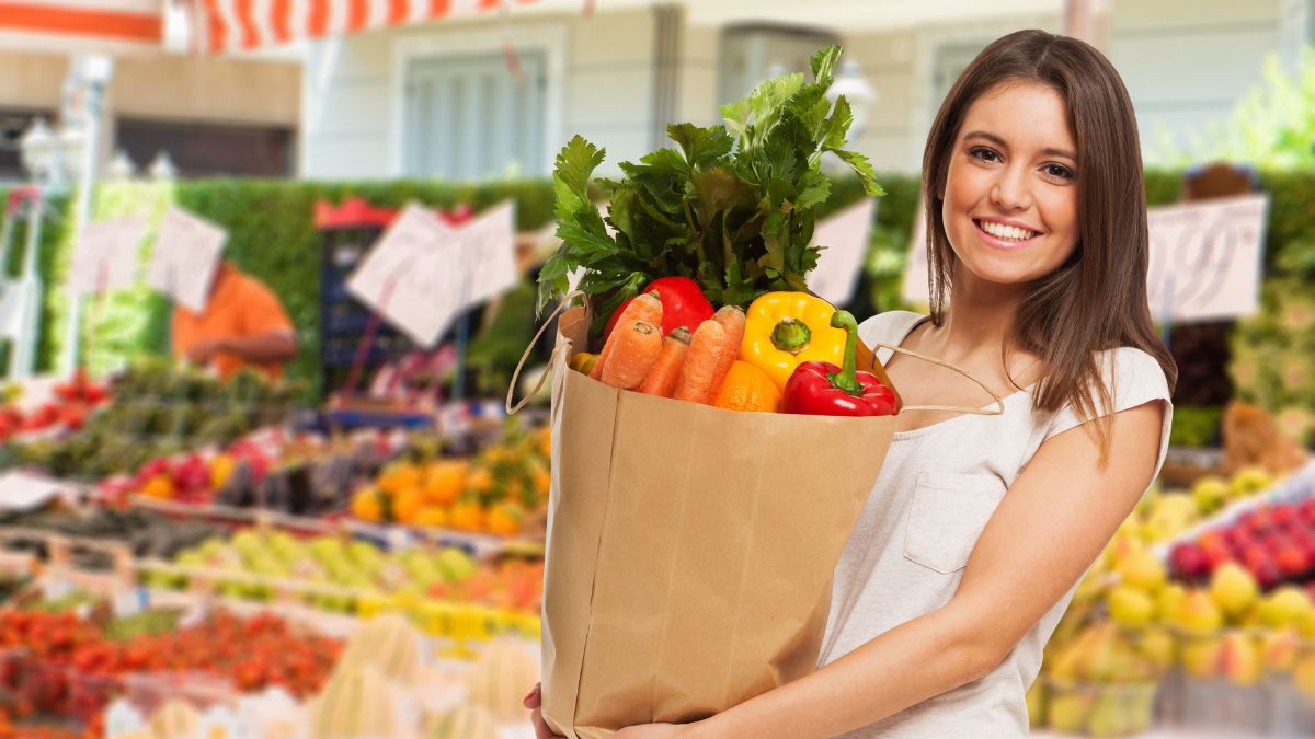 woman smiling with groceries