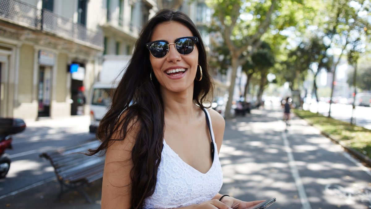 woman smiling with phone