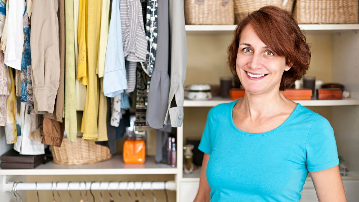 happy woman in organized closet