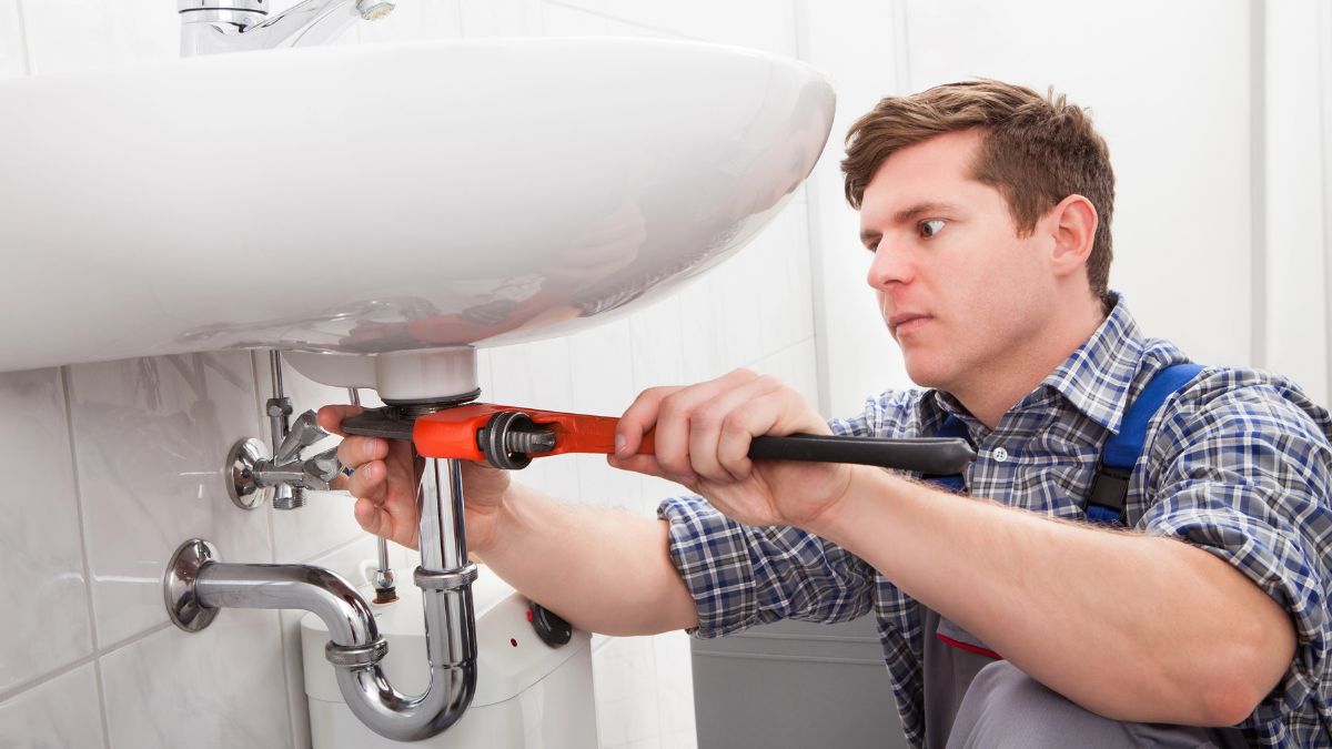 man trying to fix a leak