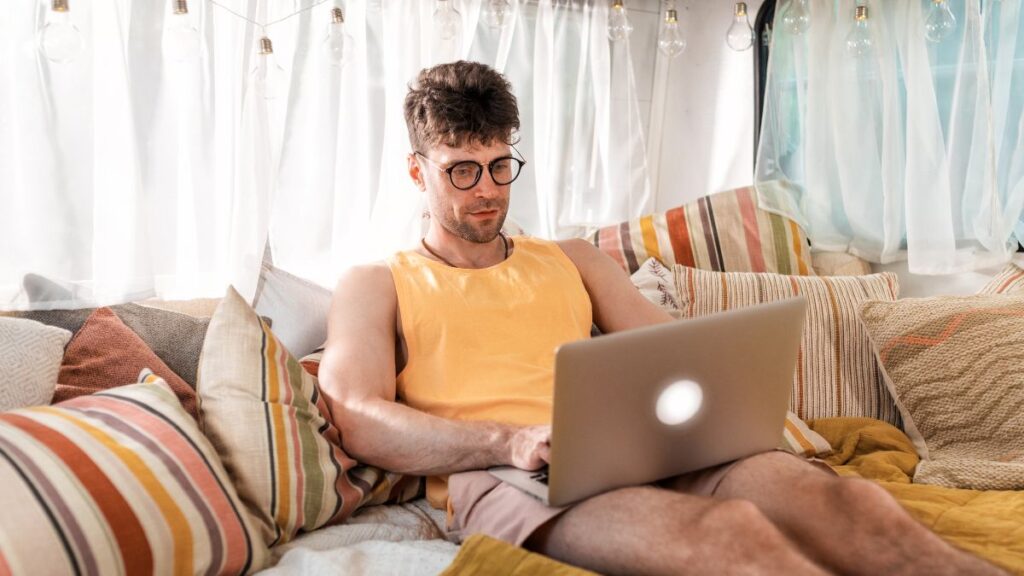 man working on bed in rv