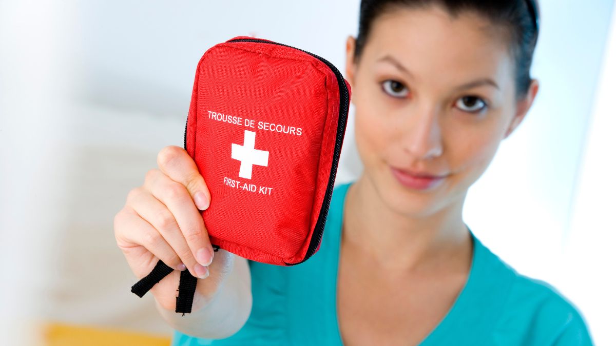 woman holding first aid kit