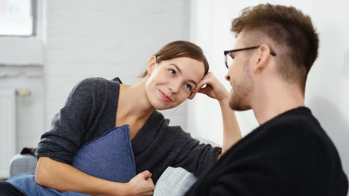 woman looking at man in a flirty way