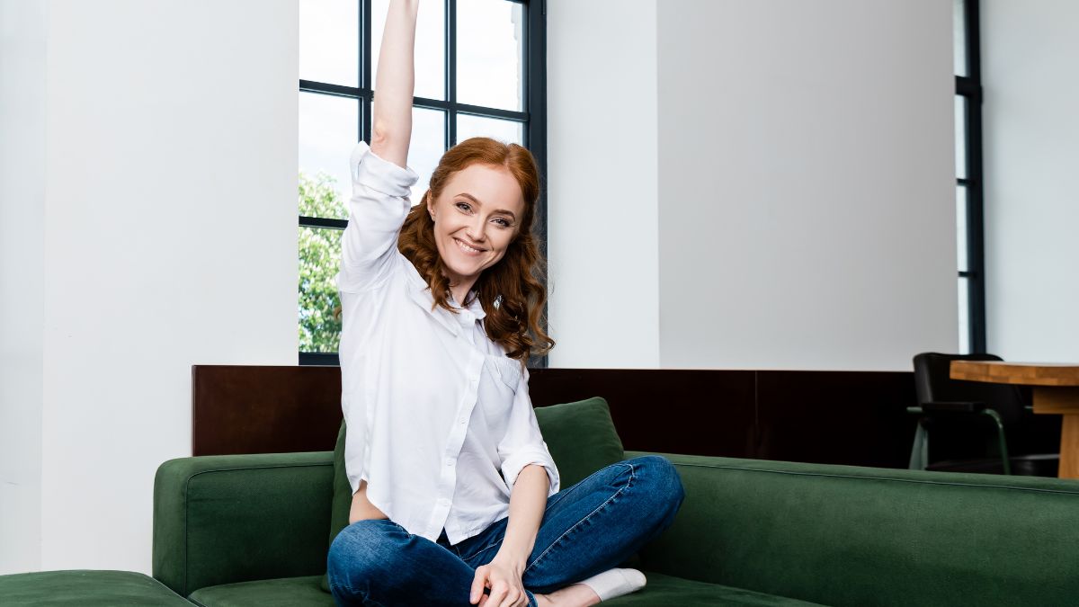 woman smiling with hand up showing success